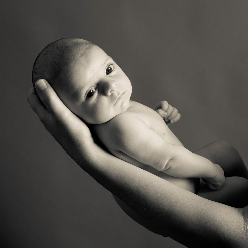baby-being-held-sepia